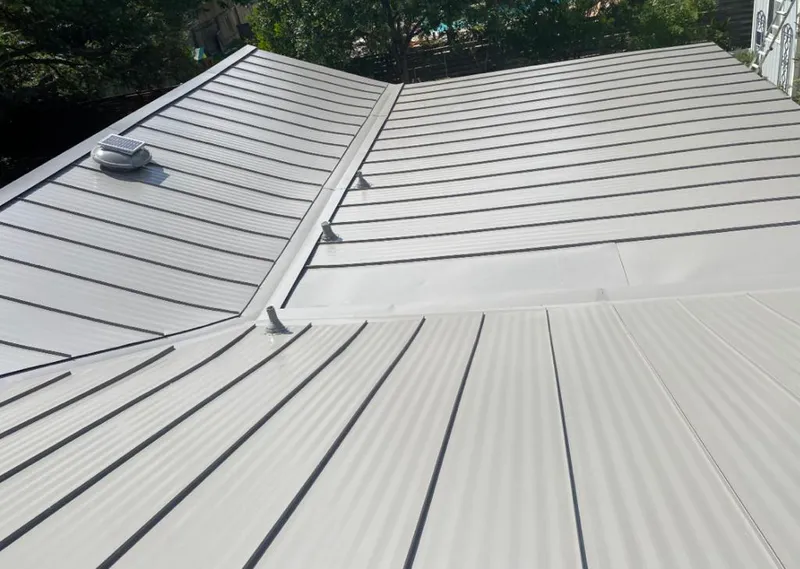 Solar attic fan installed on a metal roof for Roof Ventilation in University of California-Davis